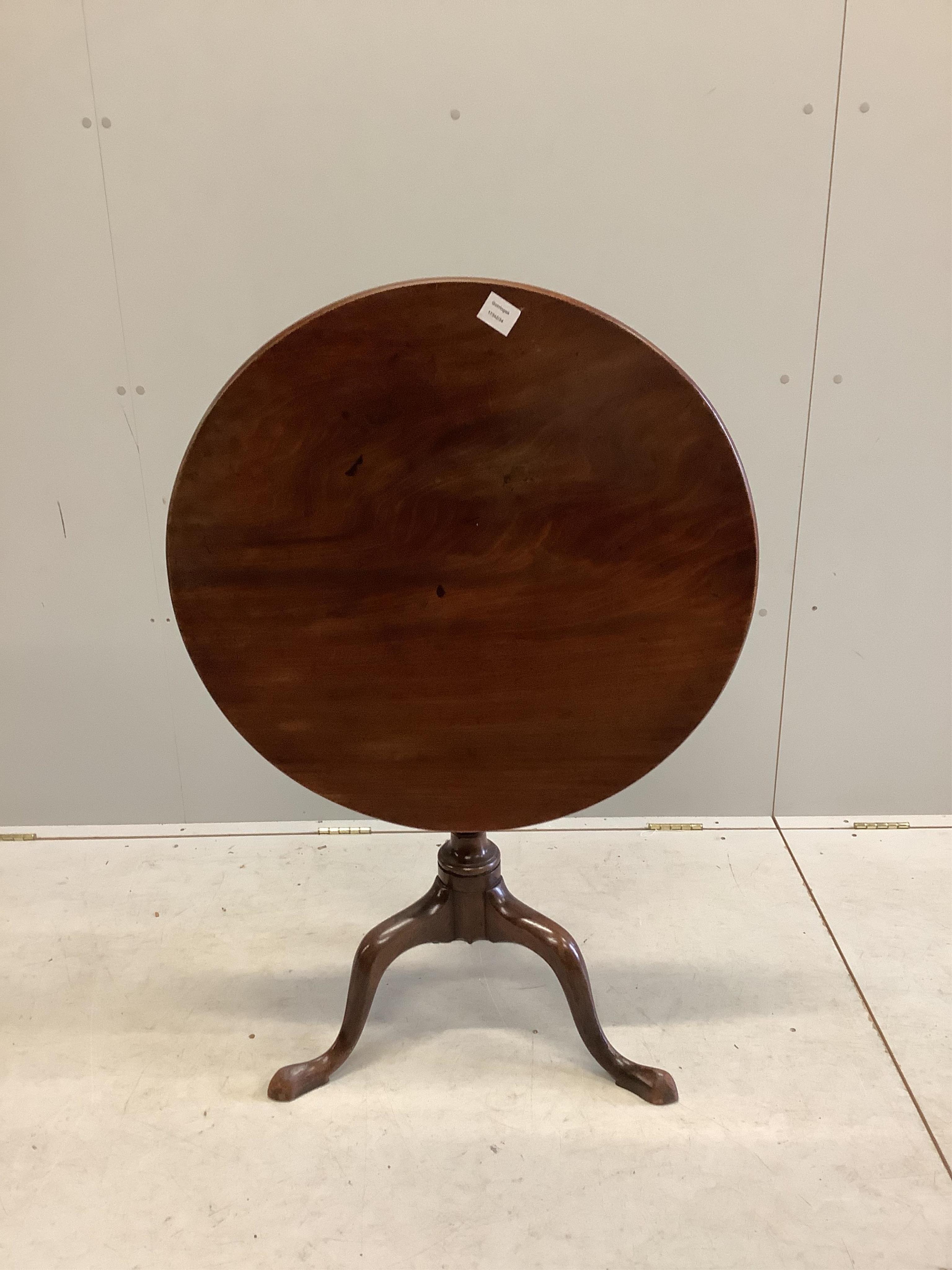 A George III mahogany circular tilt top tripod tea table, diameter 73cm, height 72cm. Condition - fair